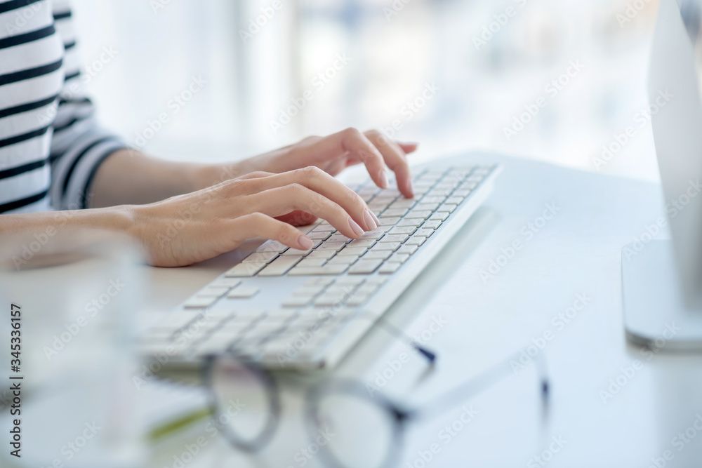 Close up picture of female hands typing Close up picture of female hands typing