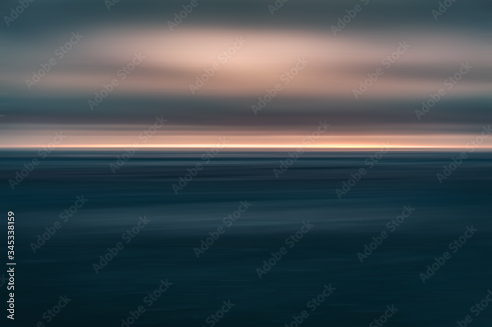 Dramatic long exposure of a dark sunset over the sea