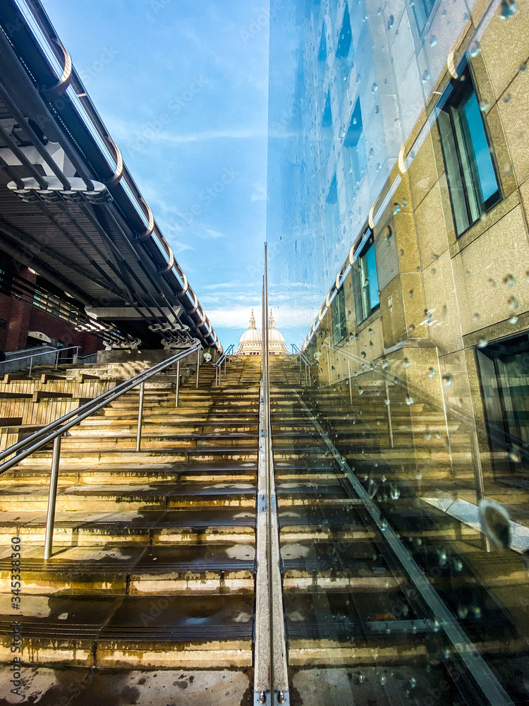 Vertical reflection of steps and St Paul's Cathedral