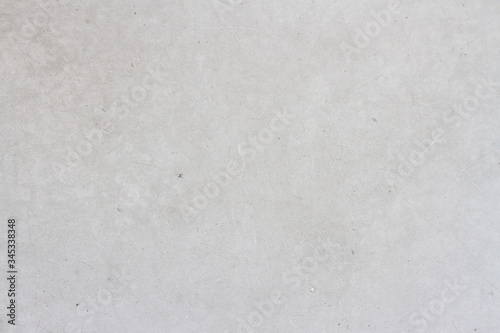 Light gray concrete wall background with texture and scuffs