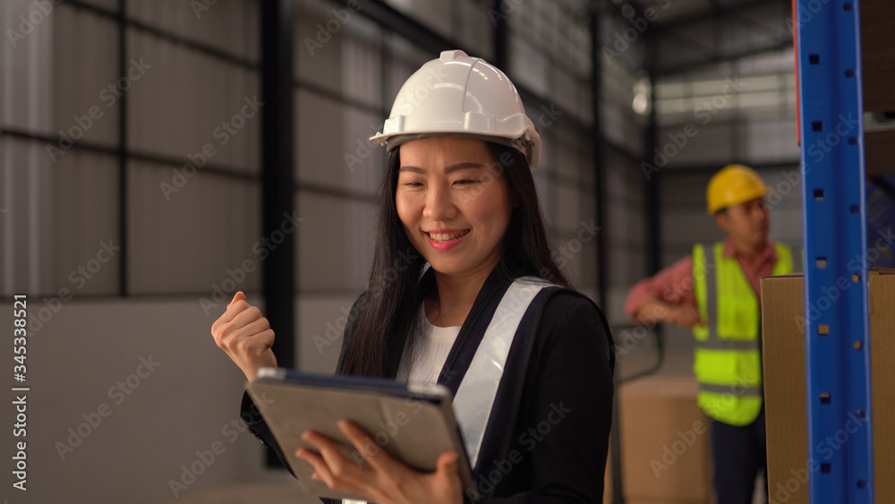 Warehouse woman worker using tablet Warehouse woman worker using tablet
