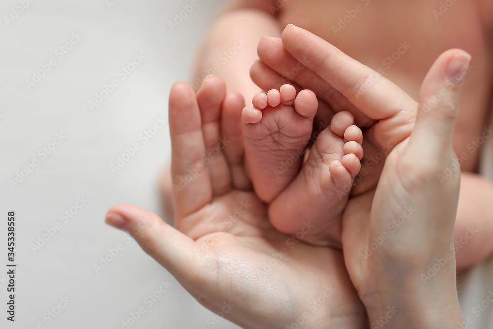 Mother holds newborn baby's bare heels on white background. Tiny feet in woman's hand. Family and home concept. Healthcare, pediatrics. Cozy morning at home. Motherhood
Mother holds newborn baby's bare heels on white background. Tiny feet in woman's hand. Family and home concept. Healthcare, pediatrics. Cozy morning at home. Motherhood