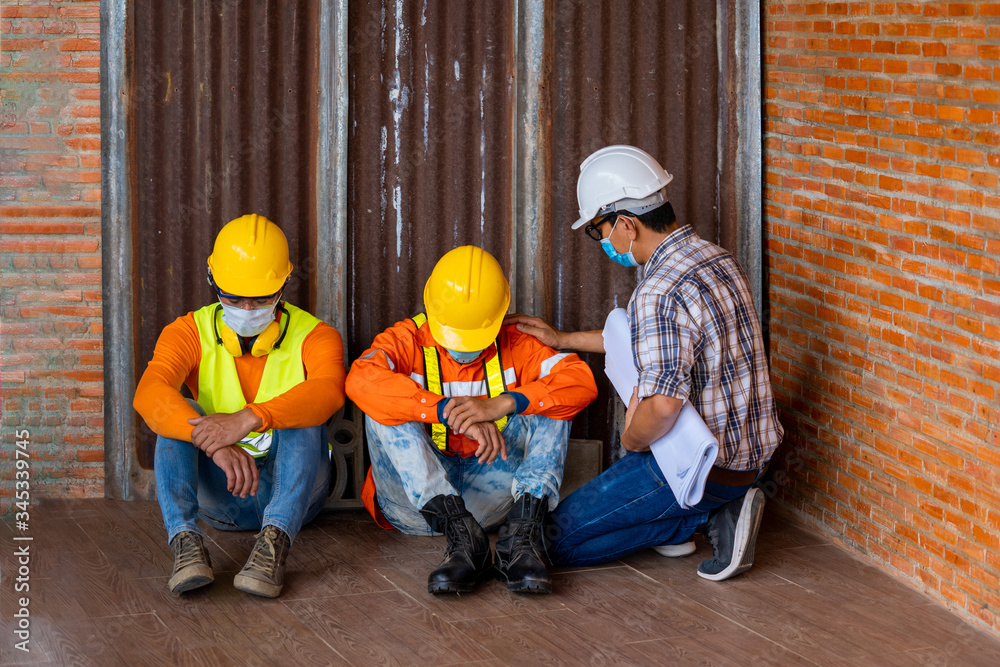 © visoot - Workers wear protective face masks for safety sitting worrying about unemployment due to the disease Covid,Coronavirus pandemic warning of risk in real estate financing or investing in asset valuable. © visoot - Workers wear protective face masks for safety sitting worrying about unemployment due to the disease Covid,Coronavirus pandemic warning of risk in real estate financing or investing in asset valuable.