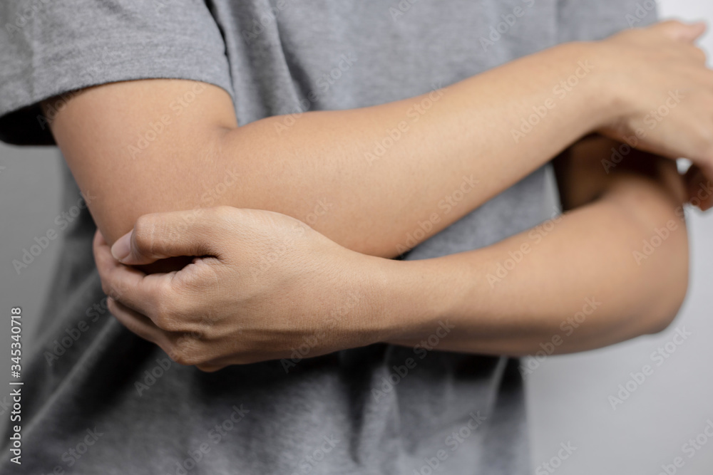 Woman with pain in elbow.