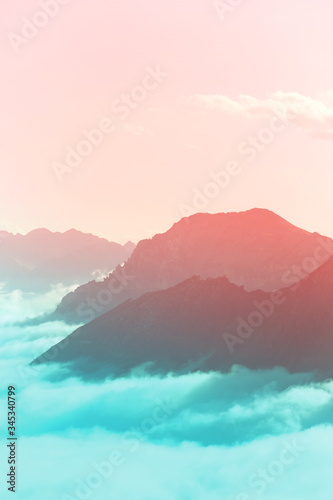 pink and teal cloudy mountain background 