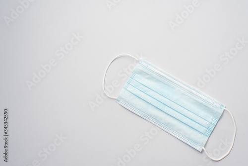 Medical mask, Medical protective mask on blue background. Disposable surgical face mask cover the mouth and nose. Healthcare and medical concept