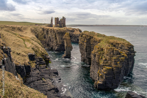ruined castle on the caithness coast in scotland