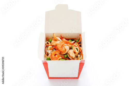 Delicious seafood wok noodles box with shrimps and udon