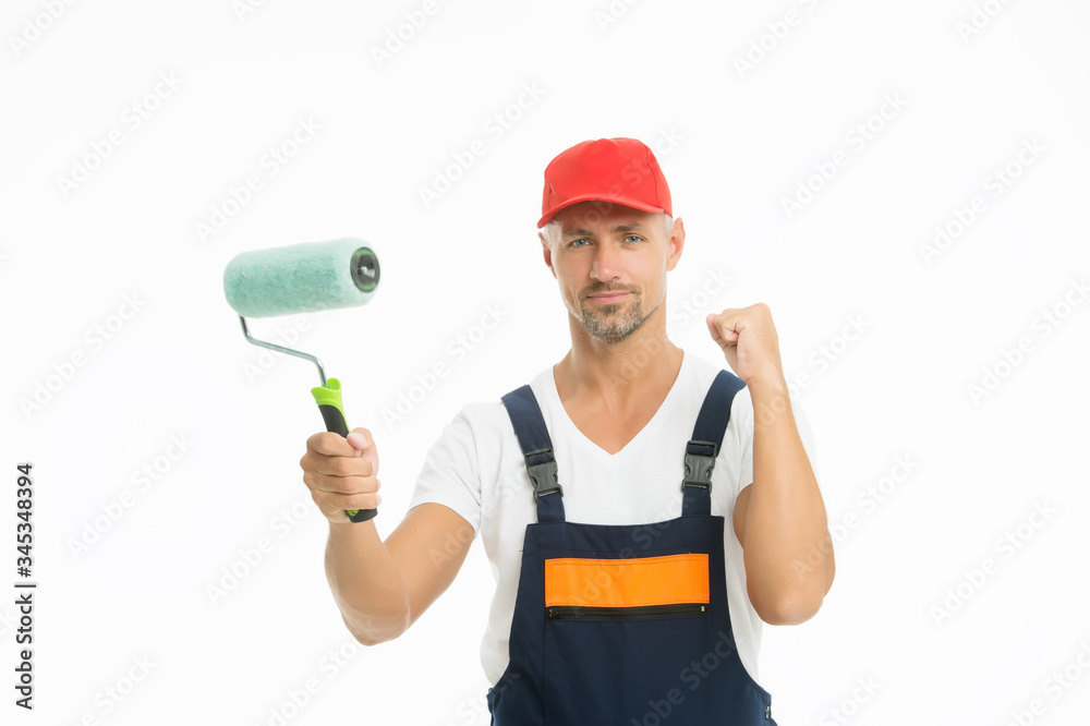 Paint entire room or just accent wall. Renewal and redecorating. Professional equipment. Mature man in cap. Paint rolling. Decorator hold paint roller. Wall painter. Paint shop. Renovation and repair Paint entire room or just accent wall. Renewal and redecorating. Professional equipment. Mature man in cap. Paint rolling. Decorator hold paint roller. Wall painter. Paint shop. Renovation and repair