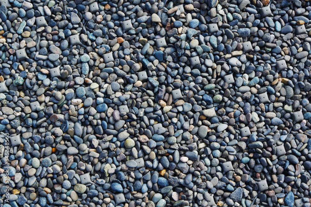 Background of blue sea stone. Pebble for decrorating the garden in a house. Rocks edge the river. Background of blue sea stone. Pebble for decrorating the garden in a house. Rocks edge the river.