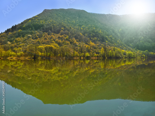 Lake and mountain in the spring with a sky