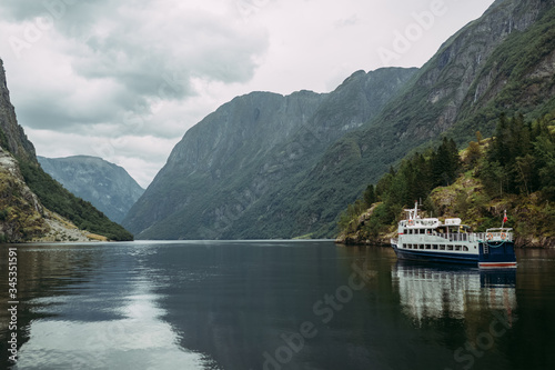 tourist ship on a mountain river against the background of the Norwegian
