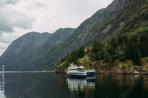 tourist ship on a mountain river against the background of the Norwegian