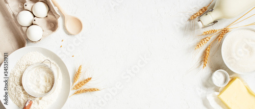 Tableau sur toile Banner with ingredients for home baking decorated with wheat ears