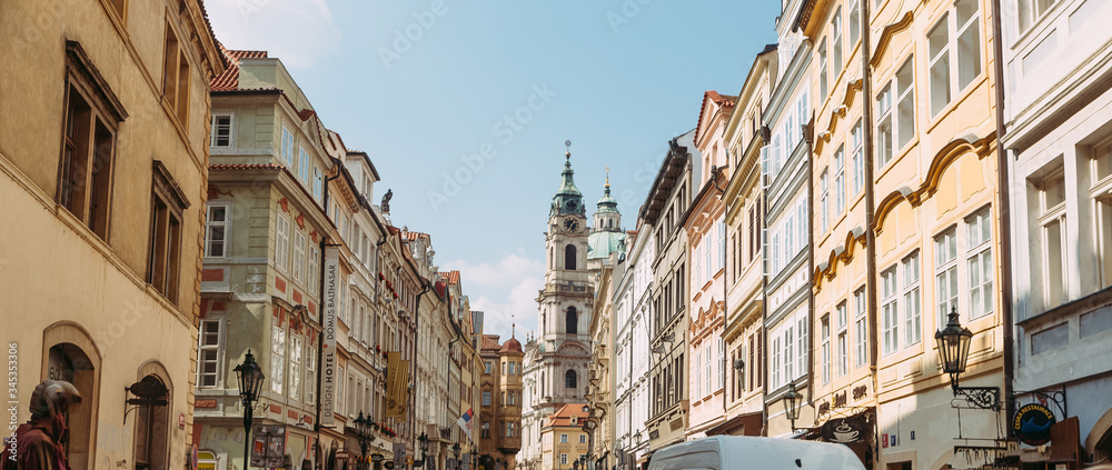 view of the church between two houses in Prague