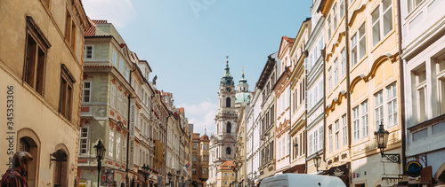 view of the church between two houses in Prague