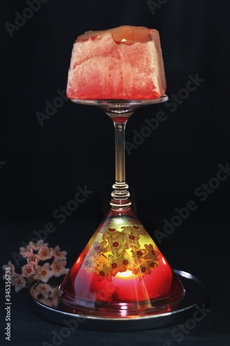 Obraz na płótnie Sweet jelly dessert, design food, creative meals with vanilla flowers in dark mood on black background w salonie