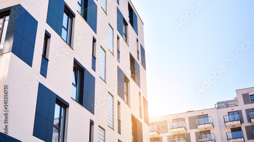 Wallpaper Mural Modern apartment buildings on a sunny day with a blue sky. Facade of a modern apartment building. Glass surface with sunlight. Torontodigital.ca