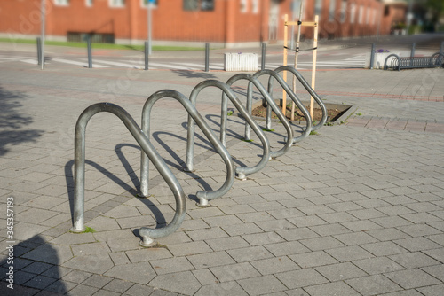 Used metal bicycle stand in the town