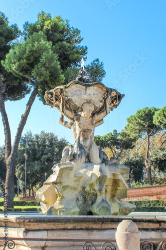 Temple of Vesta (in italian Tempio di Vesta) and Triton Fountain (n italian Fontana del Tritone ) Rome Italy