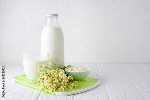 Homemade kefir. Organic probiotic kefir drink or yogurt with probiotics on a white wooden background with copy space photo