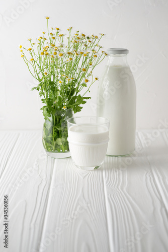 Kefir drink with on the white wooden background with copy space
