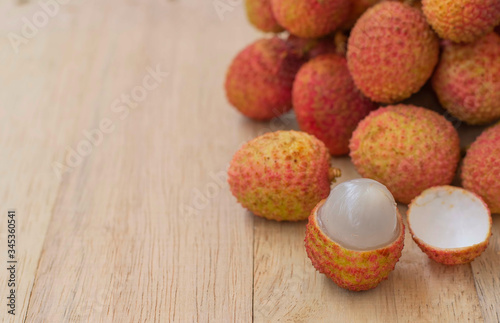 Lychee, fresh fruit placed on the wooden floor