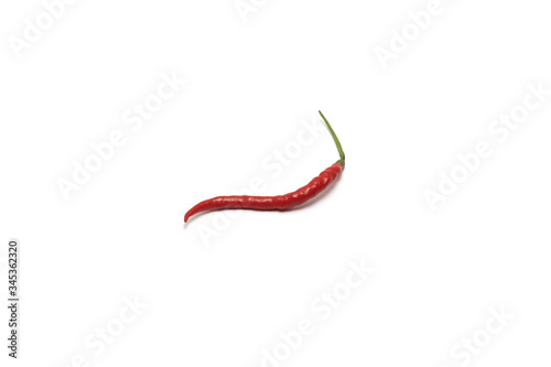 A curly red chilli (Capisicum annuum) top high angle isolated on white background