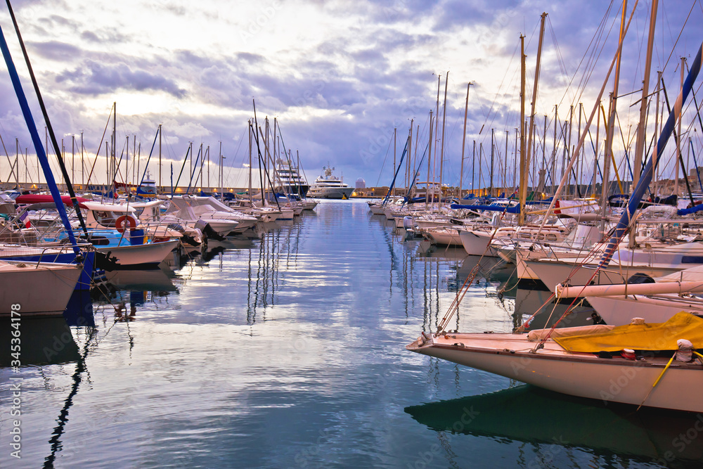 Fototapeta premium French riviera. Port Vauban harbor in Antibes colorful dusk view