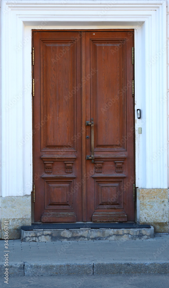 Big old light wooden door