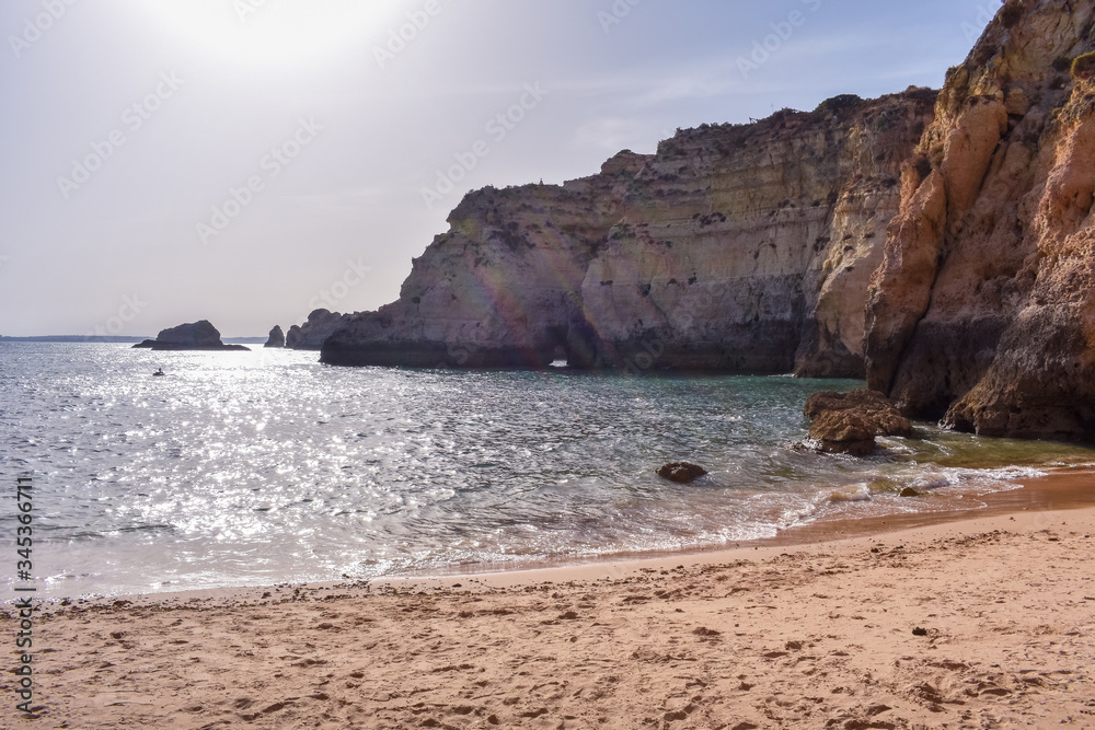 Empty beach between cliffs. Uncrowded travel concept. Algarve, Portugal