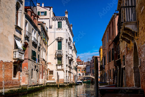 Venetian canal, old buildings and medieval bridges . © giulianocoman