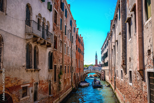 Venetian canal, old buildings and medieval bridges . © giulianocoman