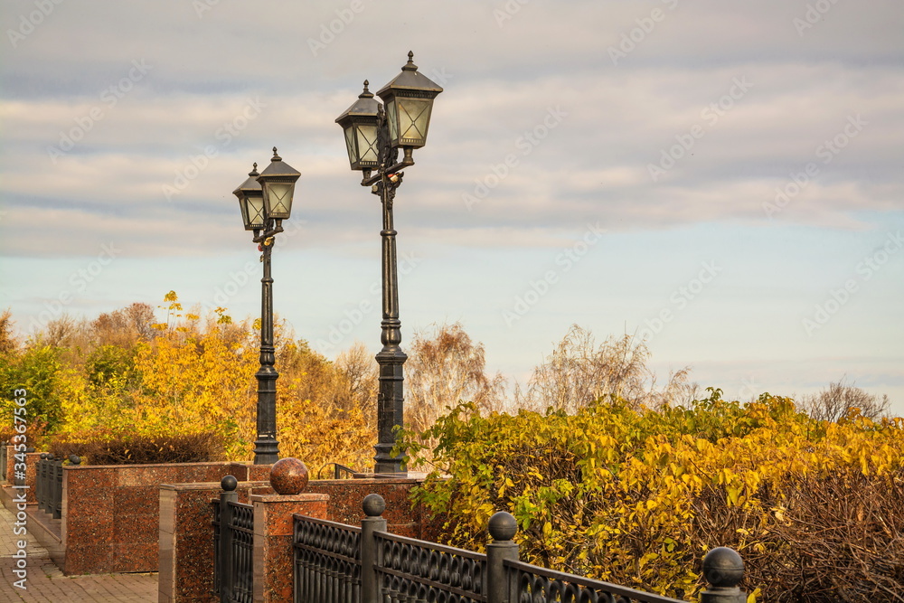 Street lamps on autumn embankment of  city of Ulyanovsk