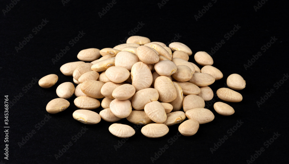 Heap of white beans isolated on black background Heap of white beans isolated on black background