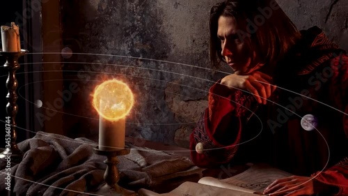 history of scientific knowledge, the concept. A young man in the image of the scientist of the middle ages and Renaissance Nicholas Copernicus, working on the heliocentric system of the world
