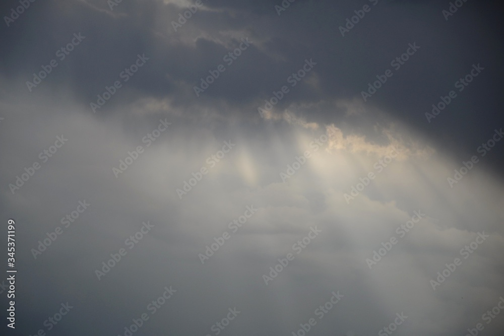 Rays of sunlight passing through the clouds