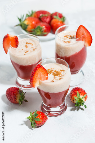 sweet strawberry yoghurt milkshake, vertical top view