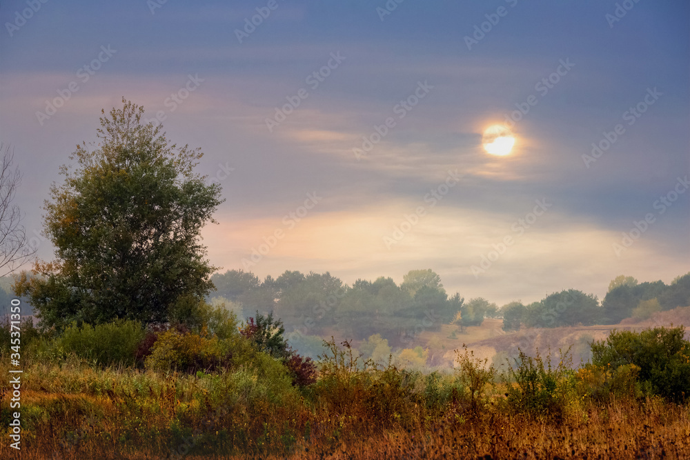 Autumn landscape with beautiful sky during sunset. Evening calm in nature