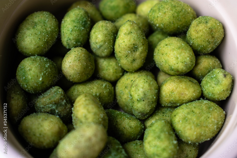 A close up of bright green Wasabi peas