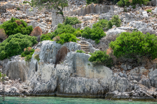 Ruins of sunken ancient city of Dolichiste on the northern part of the Kekova Island. Devastating earthquake in the 2nd century AD