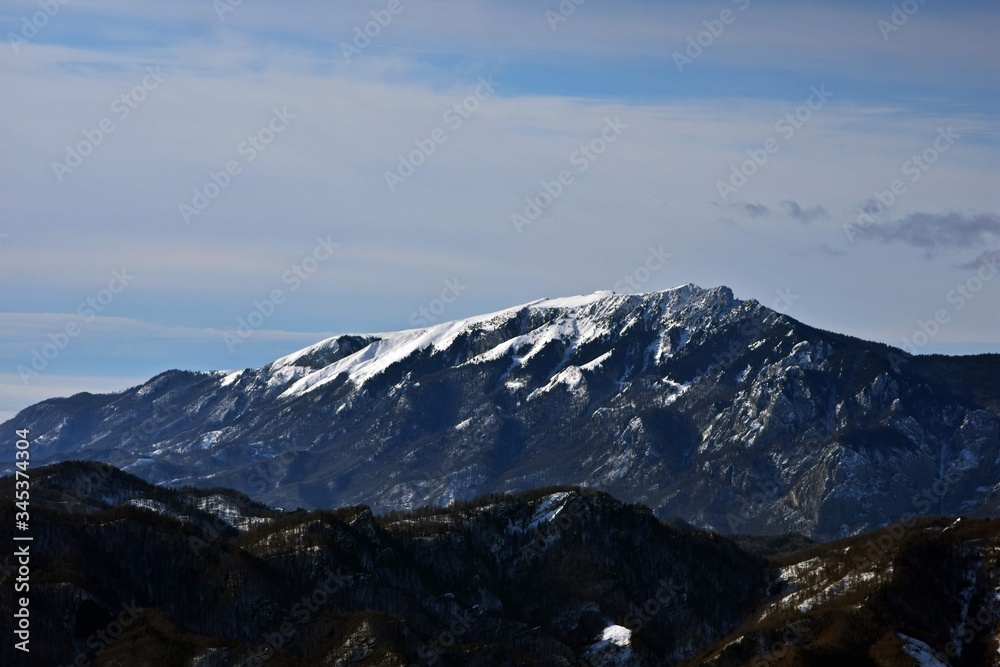 snowy mountains in winter season on sunny day at high altitude