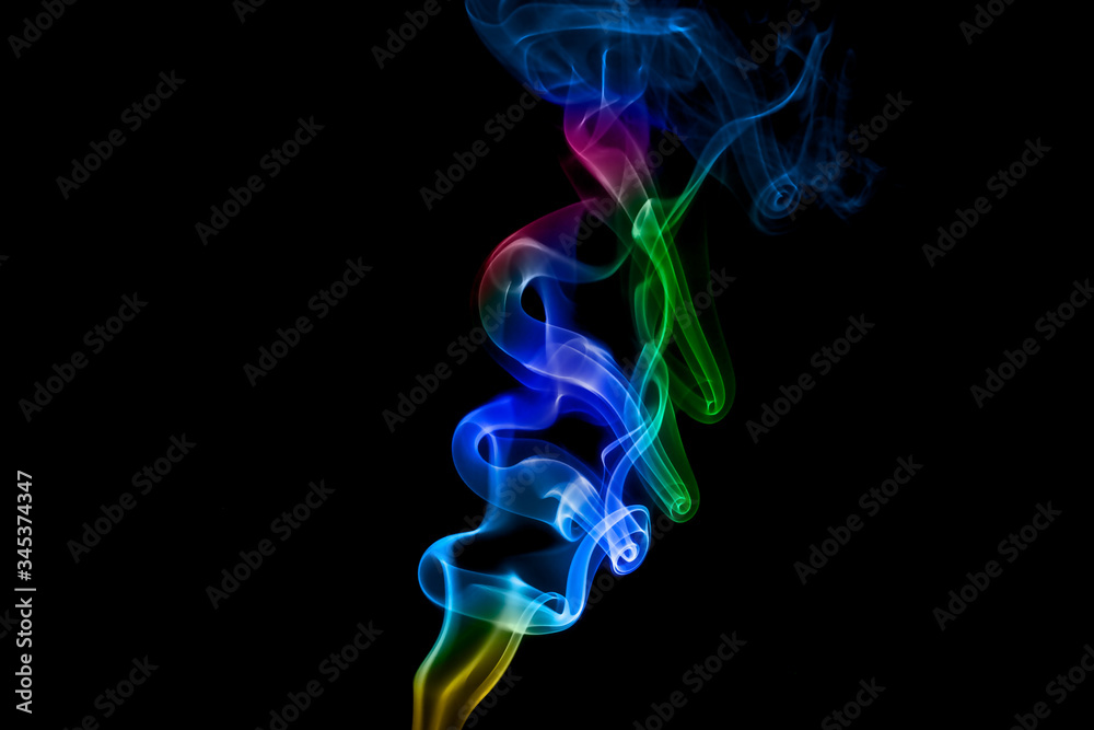 Naklejka premium Abstract colored smoke on black background