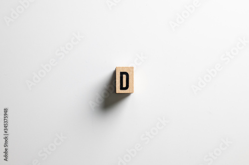 " D " text made of wooden cube on White background with clipping path.