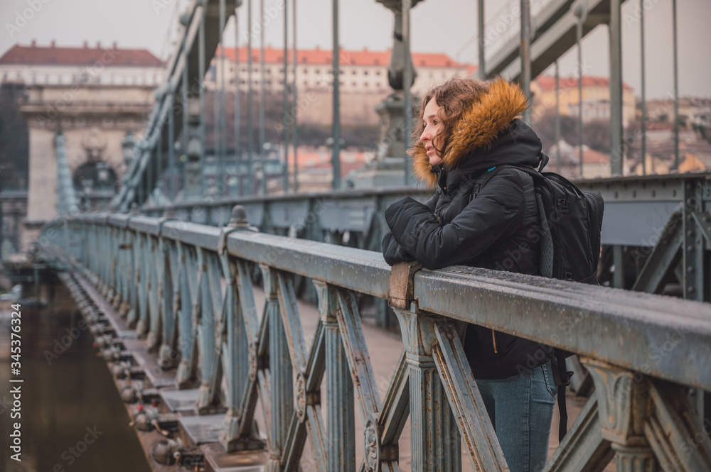 Young woman on the Chain Bridge in Budapest, Hungary Young woman on the Chain Bridge in Budapest, Hungary