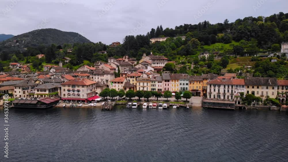 drone flying above beautiful italian city on lake orta surrounded green nature on the background mountain landscape drone flying above beautiful italian city on lake orta surrounded green nature on the background mountain landscape