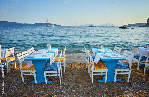 Cute chairs and table on the beach at seaside restaurant in Bodrum © Ryzhkov Oleksandr