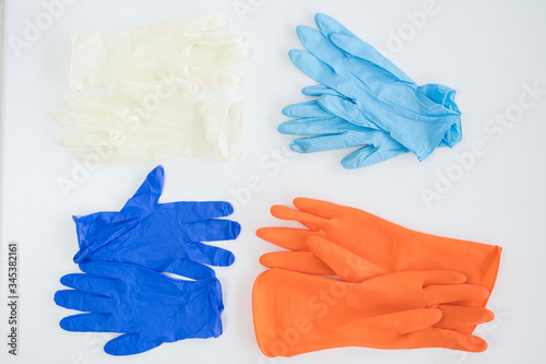 Different gloves isolated on white background.Personal protective tool for against infection disease.Medical accesory for infectious control concept.