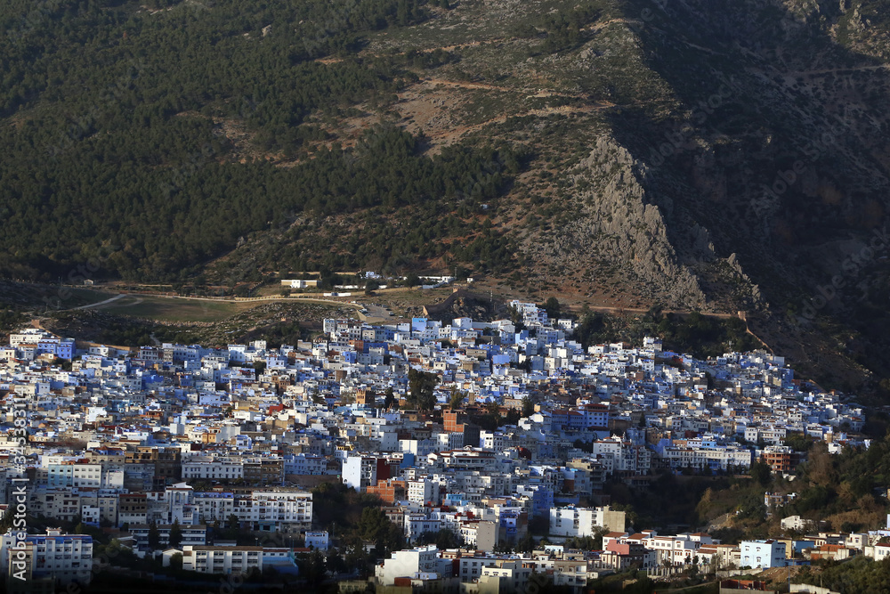 Chefchaouen, Morocco - 02.24.2019: View from the ramparts to a unique city in which all buildings are painted in blue.