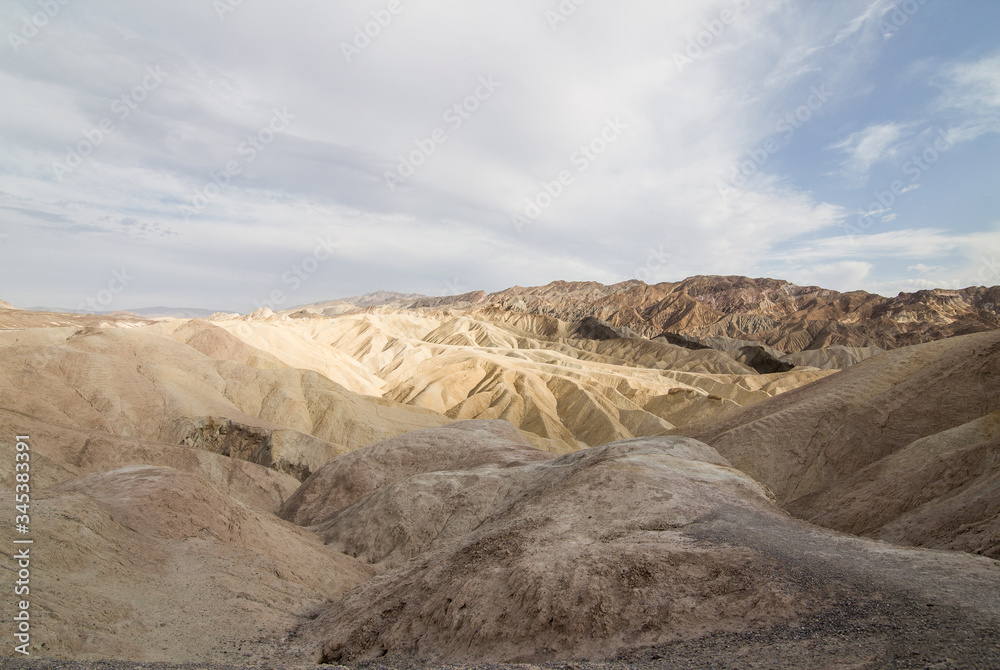 Panoramic view on Zabriskie Point in Death Valley with colorful rock formations - View panoramic landscape of death valley